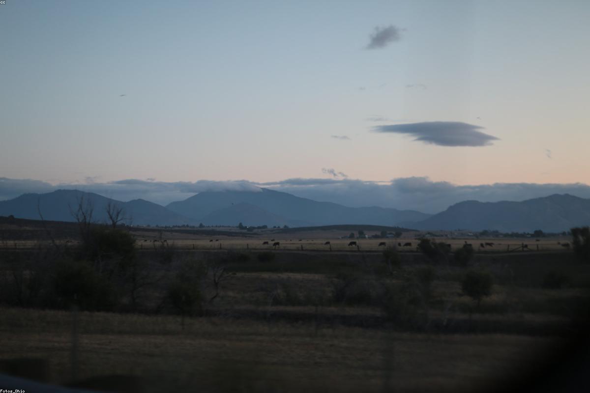 Horizon glow and dark hills