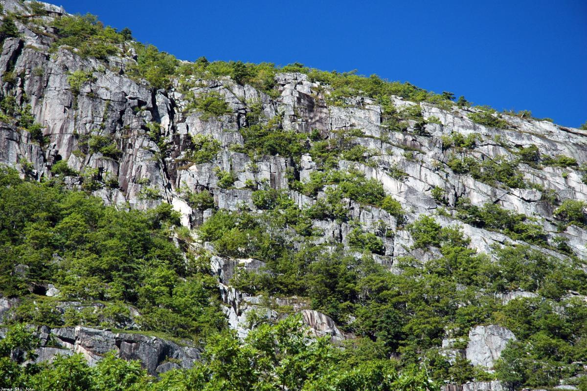 Granite cliff under low cloud